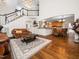 Open-concept living room showcasing beautiful wood floors and an open staircase at 3581 Boulder Ct, Wake Forest, NC 27587