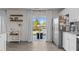 Modern kitchen featuring stainless steel refrigerator and sliding glass door to patio at 3641 Drafton Dr, Raleigh, NC 27610