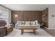 A comfortable living room with hardwood floors, a modern sofa, and stylish wall accents at 3641 Drafton Dr, Raleigh, NC 27610