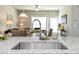 Modern kitchen sink features granite countertops and an open-concept design that connects to the living area at 367 Deodora Lane Ln, Cameron, NC 28326