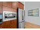Modern kitchen featuring stainless steel appliances and wooden cabinets at 400 W North St # 900, Raleigh, NC 27603