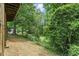 A spacious backyard is partially fenced with mature trees offering a private outdoor space at 4404 Oak Park Rd, Raleigh, NC 27612