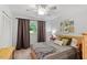Inviting bedroom with soft lighting, neutral colors, comfortable bed, and decorative wall art at 4404 Oak Park Rd, Raleigh, NC 27612