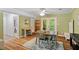 A dining area next to an office space offers a versatile and open layout, great for entertaining and working from home at 4404 Oak Park Rd, Raleigh, NC 27612