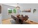 Bright dining room with wood table and chairs, natural light, and simple elegant decor at 4404 Oak Park Rd, Raleigh, NC 27612