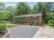 Spacious driveway leading to a well-maintained home, surrounded by lush greenery and mature trees at 4404 Oak Park Rd, Raleigh, NC 27612