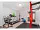 A home gym featuring a treadmill, weight rack, and exercise equipment, providing fitness opportunities at home at 4404 Oak Park Rd, Raleigh, NC 27612
