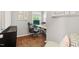 Home office features an ergonomic chair and a desk by the window at 4404 Oak Park Rd, Raleigh, NC 27612