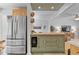 Kitchen with a refrigerator and view to the living area at 4404 Oak Park Rd, Raleigh, NC 27612