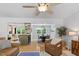Open-concept living space with hardwood floors, connecting the kitchen, dining and living areas at 4404 Oak Park Rd, Raleigh, NC 27612