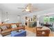 Bright and airy living space with hardwood floors and an open view into the dining and kitchen areas at 4404 Oak Park Rd, Raleigh, NC 27612