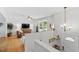 Bright living room featuring neutral paint, updated lighting, and a cozy reading nook near the front door at 4404 Oak Park Rd, Raleigh, NC 27612