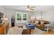 Comfortable living area with hardwood floors, stylish furnishings, and large windows for natural light at 4404 Oak Park Rd, Raleigh, NC 27612