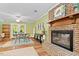 Open-concept living area featuring a fireplace, dining space, and ample natural light at 4404 Oak Park Rd, Raleigh, NC 27612