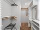 Walk-in closet with custom shelving, wood dowels and a valet rack at 4404 Oak Park Rd, Raleigh, NC 27612