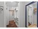 Walk-in closet with custom shelving, a mirrored door and lots of storage space at 4404 Oak Park Rd, Raleigh, NC 27612