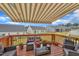 Inviting outdoor living on a spacious deck featuring comfortable seating and a retractable awning at 48 Highview Ct, Fuquay Varina, NC 27526