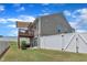 Exterior view of the home featuring a private fenced backyard with a deck at 48 Highview Ct, Fuquay Varina, NC 27526