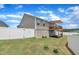 A spacious, fenced yard with a deck offers a private oasis for outdoor relaxation at 48 Highview Ct, Fuquay Varina, NC 27526