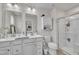 Bright bathroom with double vanity, ample counter space, and a glass-enclosed shower for a spa-like experience at 48 Highview Ct, Fuquay Varina, NC 27526