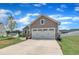 Attractive home featuring a two-car garage, well-manicured lawn, and a welcoming driveway at 48 Highview Ct, Fuquay Varina, NC 27526