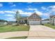Inviting home with a well-kept lawn, two-car garage, and a cozy front entrance at 48 Highview Ct, Fuquay Varina, NC 27526