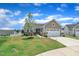 Beautiful home with a manicured lawn, two-car garage, and a scenic neighborhood view at 48 Highview Ct, Fuquay Varina, NC 27526