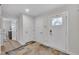 Hallway featuring an entryway, interior door, and neutral walls with carpet at 48 Highview Ct, Fuquay Varina, NC 27526