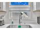 A bright and well-maintained kitchen sink area features a window to the outdoors at 48 Highview Ct, Fuquay Varina, NC 27526