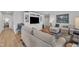 Comfortable living room with a TV, built-in shelving, and cozy seating arrangements at 48 Highview Ct, Fuquay Varina, NC 27526