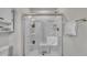 Modern shower equipped with convenient grab bars, built-in shelving, and a comfortable seat at 48 Highview Ct, Fuquay Varina, NC 27526