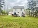 This backyard features a deck and green space at 50 Teal Dr, Youngsville, NC 27596