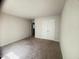 This bedroom features neutral paint, carpet, and a closet at 50 Teal Dr, Youngsville, NC 27596