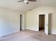 A tranquil bedroom with neutral carpeting, a ceiling fan, and ample closet space at 50 Teal Dr, Youngsville, NC 27596
