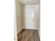 Bright entryway featuring wood-look flooring and a white front door, creating a welcoming first impression at 50 Teal Dr, Youngsville, NC 27596