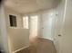 This hallway features carpet and white doors at 50 Teal Dr, Youngsville, NC 27596