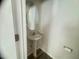 Cozy powder room with a stylish pedestal sink, oval mirror, and modern fixtures at 50 Teal Dr, Youngsville, NC 27596