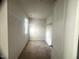 A simple walk-in closet with wire shelving and carpeted floors at 50 Teal Dr, Youngsville, NC 27596