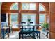 Charming dining area with wooden table, vaulted ceilings, and natural light, creating a cozy and inviting space at 52 Buoy Dr, Henderson, NC 27537