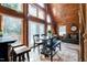 Charming dining area with wooden table, vaulted ceilings, and natural light, seamlessly blending with living space at 52 Buoy Dr, Henderson, NC 27537