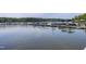 A beautiful waterfront view of multiple docks with boats and serene lake waters at 52 Buoy Dr, Henderson, NC 27537