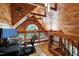 Upstairs office space overlooking a wooded view with modern desk setup and natural lighting at 52 Buoy Dr, Henderson, NC 27537