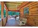 Cozy porch with a wooden swing, perfect for relaxing and enjoying the outdoors at 52 Buoy Dr, Henderson, NC 27537