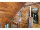 View of wooden staircase with decorative hanging lanterns, providing warm, inviting light at 52 Buoy Dr, Henderson, NC 27537
