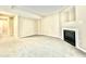 Spacious finished basement featuring neutral carpet, bright walls, and a cozy fireplace at 5419 Vista View Ct, Raleigh, NC 27612