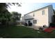 Spacious backyard featuring a patio area, lush green lawn, and mature trees for shade and privacy at 5456 Thunderidge Dr, Raleigh, NC 27610