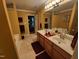 Bathroom with double sinks, large mirror, and jacuzzi tub at 5456 Thunderidge Dr, Raleigh, NC 27610