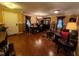 Elegant dining room featuring hardwood floors, stylish lighting, and ample seating at 5456 Thunderidge Dr, Raleigh, NC 27610