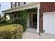 Charming front porch with lush greenery and inviting entrance, offering a warm and welcoming curb appeal at 5456 Thunderidge Dr, Raleigh, NC 27610