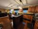 Bright kitchen features stainless appliances, hardwood floors, a central island with bar seating and ample cabinet space at 5456 Thunderidge Dr, Raleigh, NC 27610